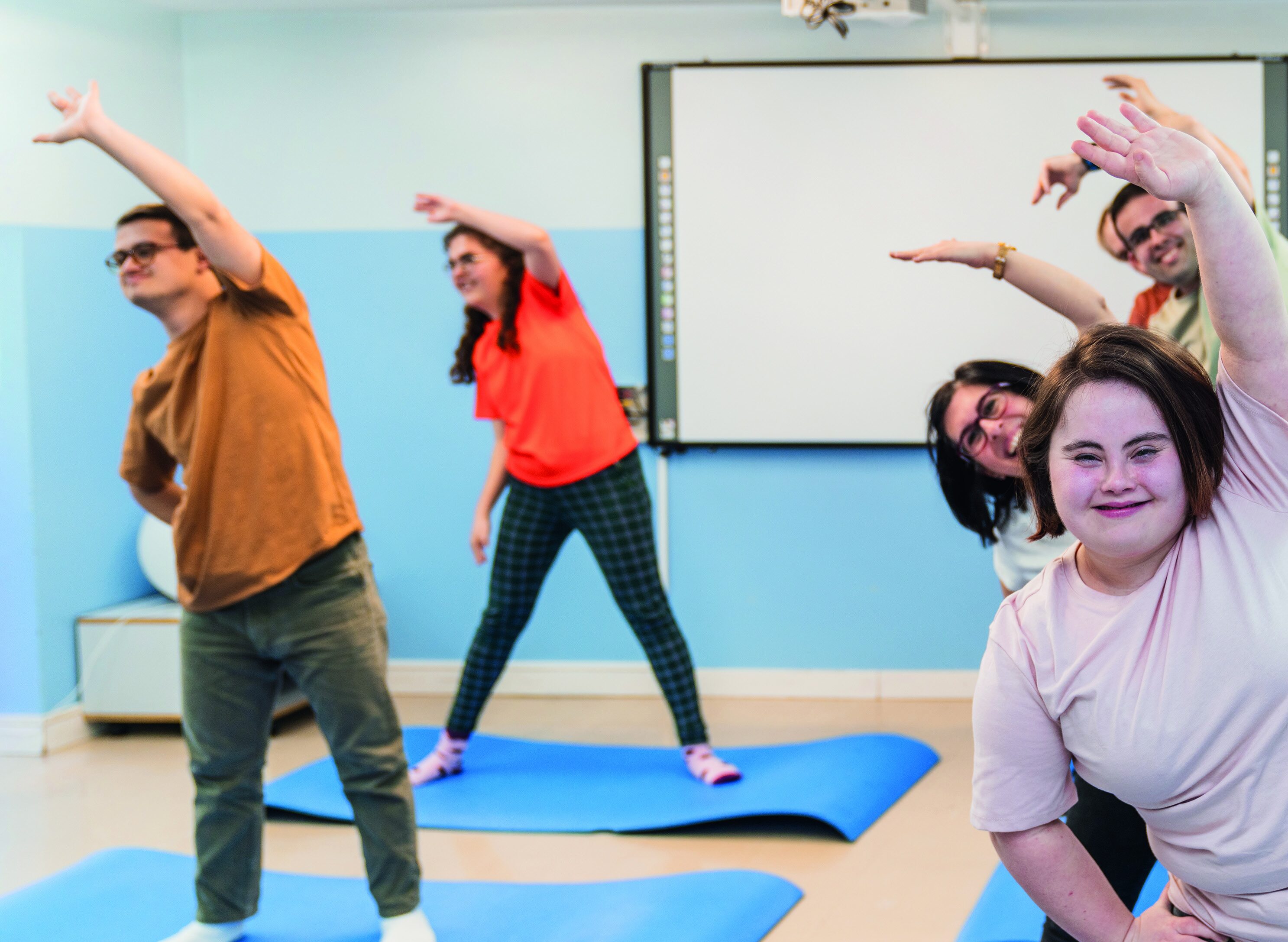 Group of people exercising in a gym class