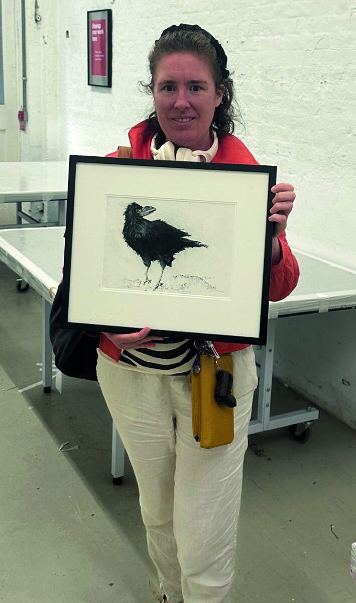 Leila Nelson with their painting Crow