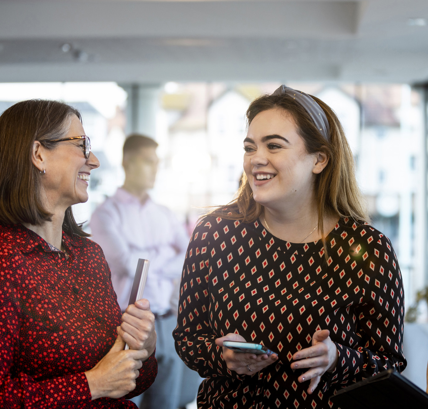 Colleagues chatting in the office