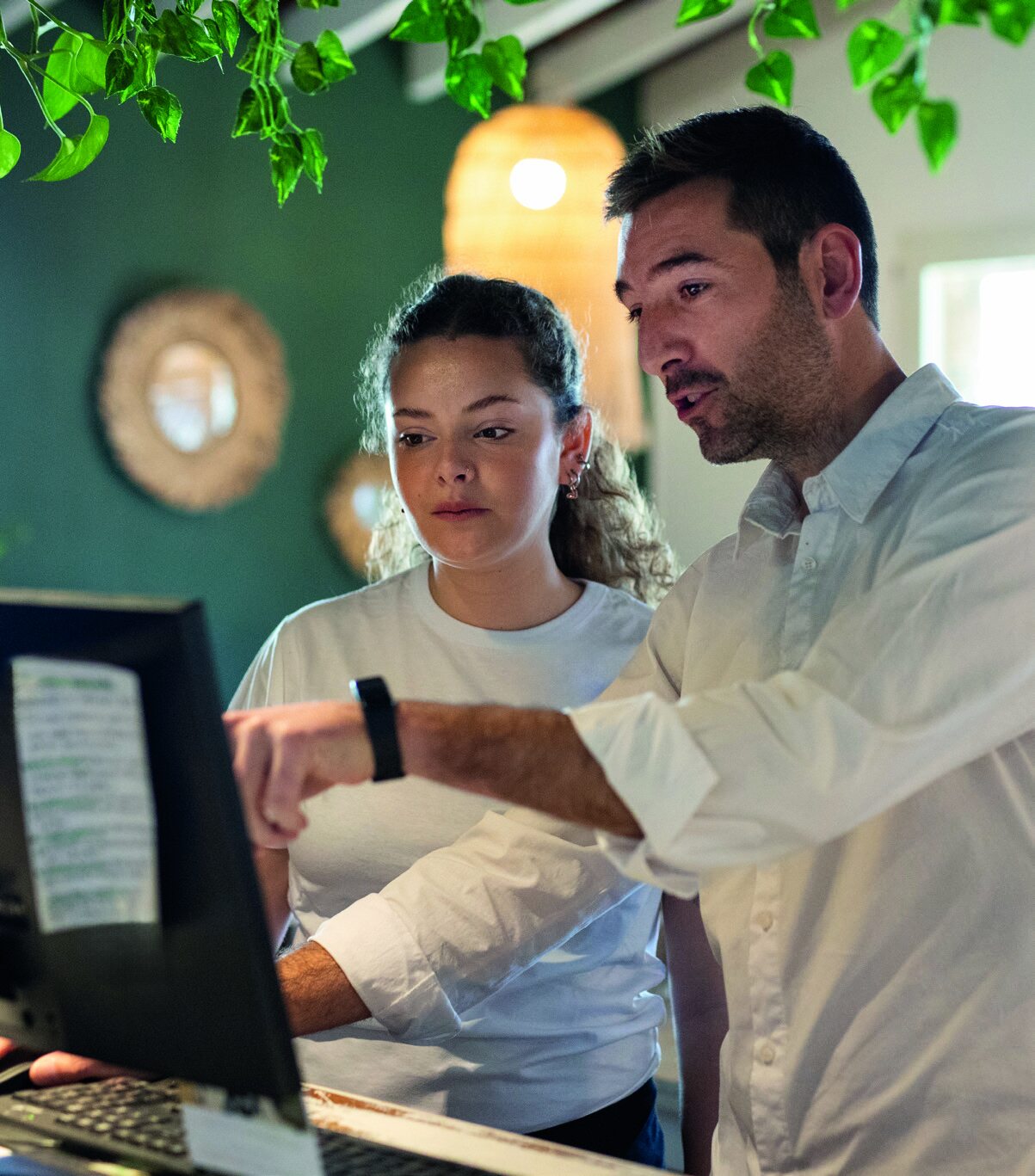 Young person on their first day of work learning in a coffee shop
