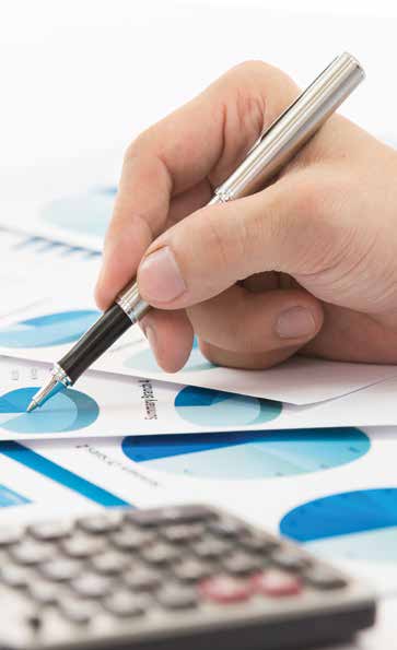 Hand pointing at financial graph with a pen