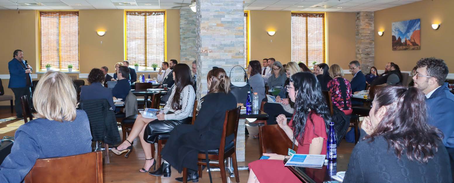 Scott Rathbun presenting industry data to attendees at the luncheon.