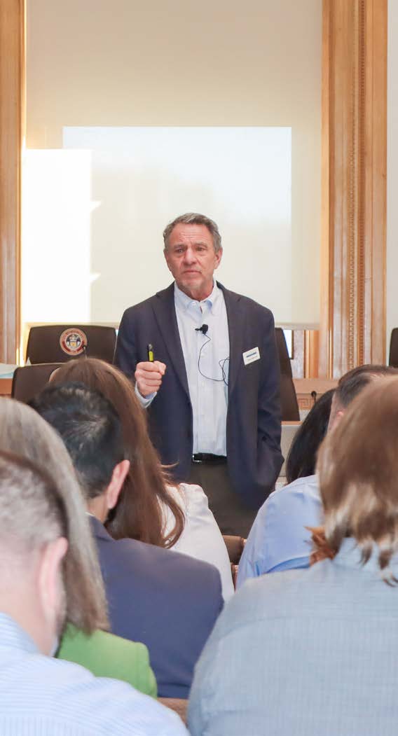 Portrait of Drew Hamrick presenting.