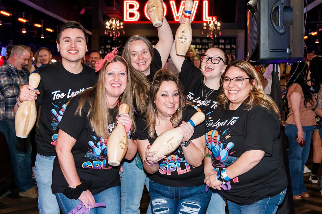 Gutter Ballers team holding bowling pins