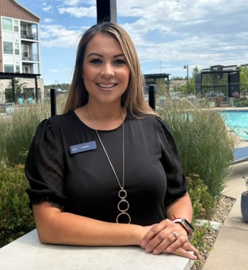 Portrait of Cherry Dao-Ward smiling outdoors at an apartment community