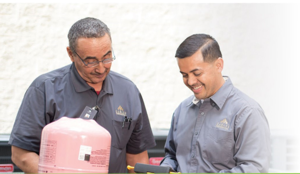 Two maintenance technicians working together