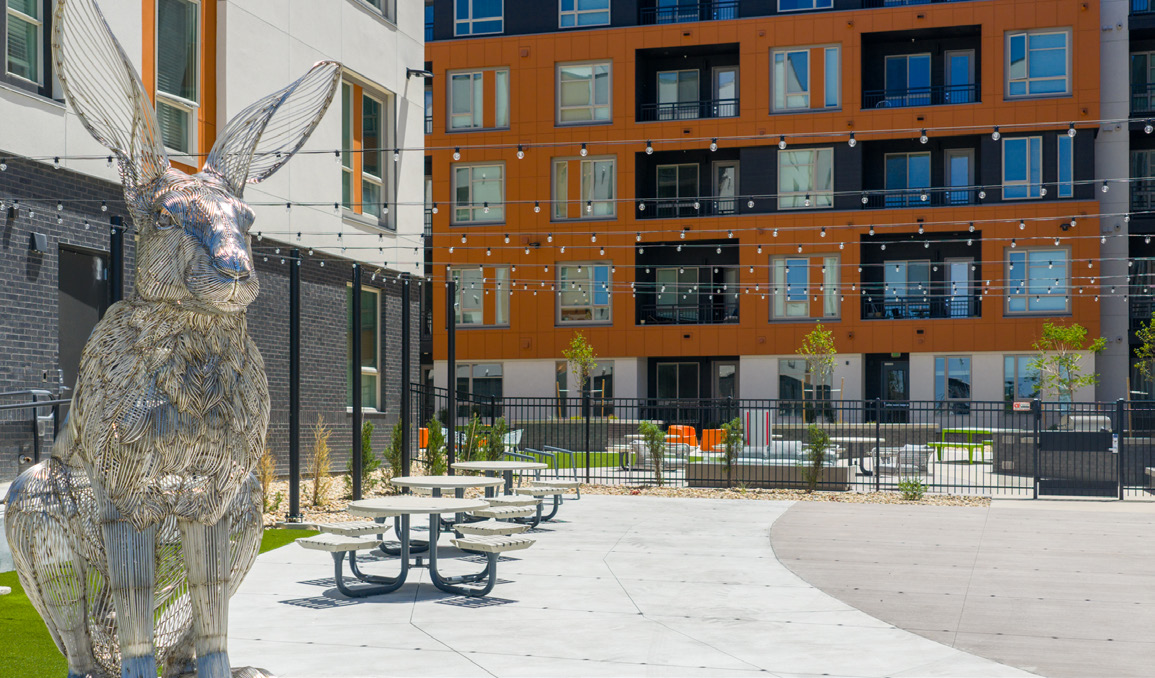 Courtyard with a rabbit sculpture at Legacy Metro 525