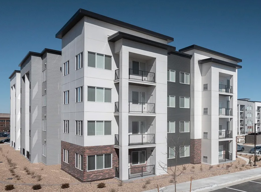 Exterior of Addie at Metro Center, showing apartment buildings, balconies and landscaped grounds