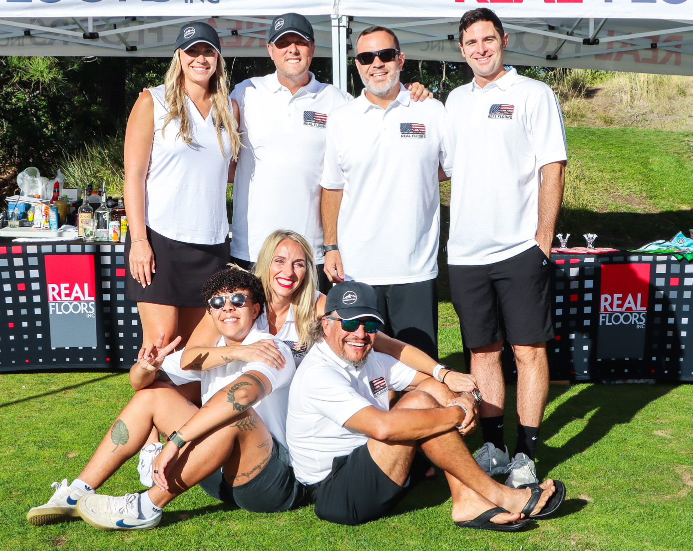 Members of the Real Floors team pose together at the Metro Masters tournament.