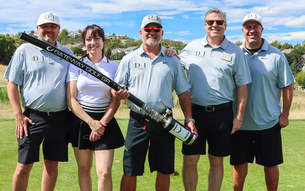 Dixie Interiors group posing on the golf course