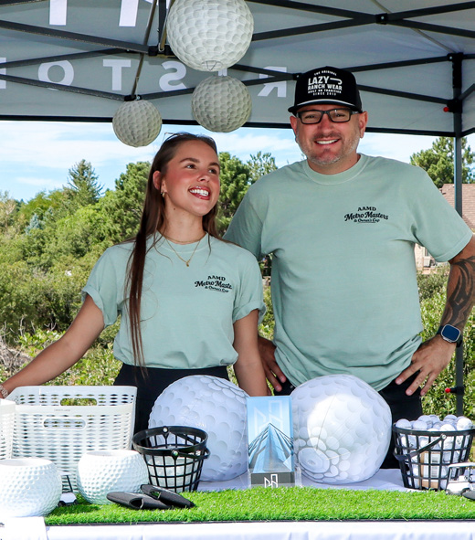 Tristone Construction representatives at a golf-course booth